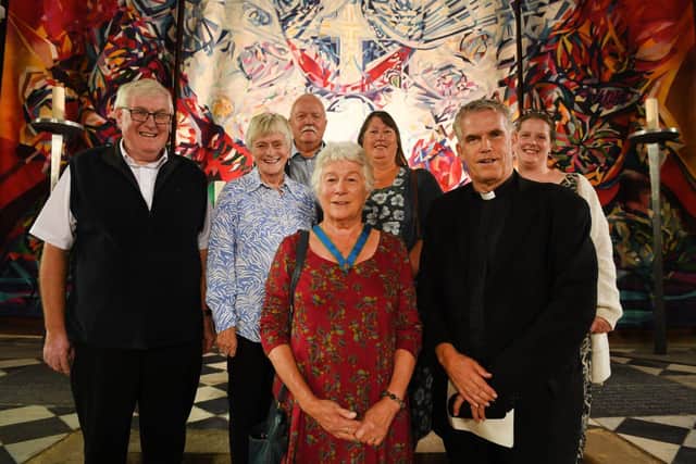 Ann Kaiser with her family and Parish priest Fr Paul Seaman