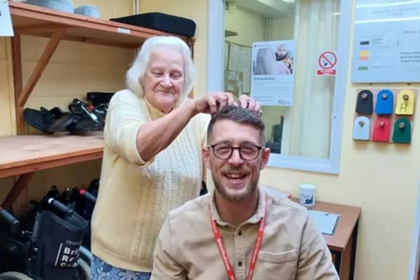 British Red Cross volunteer Jack Kenton is allowing Pat Wise from Rustington to bleach his hair as he bids to raise money to help her
