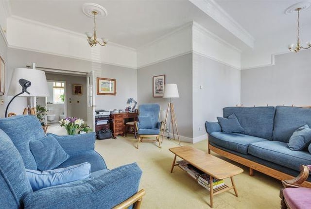 French doors lead out from the living room into the hallway
