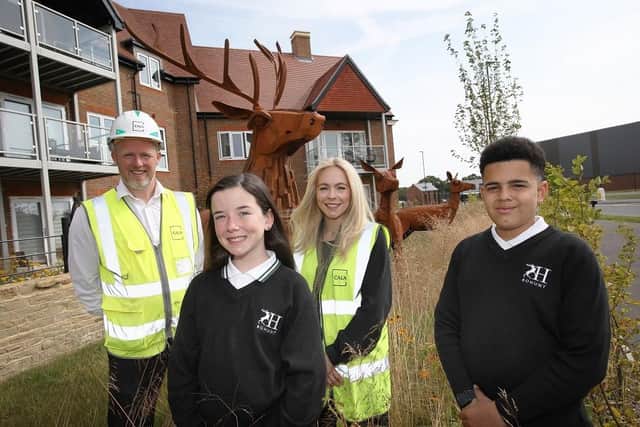 Two  of the three winners from Bohunt School,  Tristan and Pippa alongside the deer they named and representatives from Cala Homes. Photo contributed