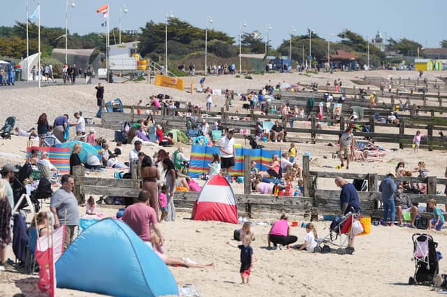 Beachgoers have flocked to a Sussex seaside town to soak up the sun
