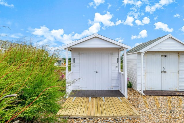 The eventual buyers fended off competition by purchasing the white beach hut for £65,000 - £15,000 above the asking price. Photo: Warwick Baker estate agents