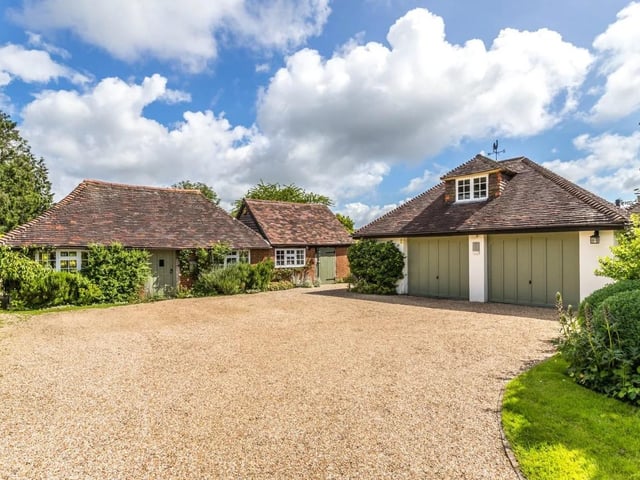 The home has a double garage with a room above