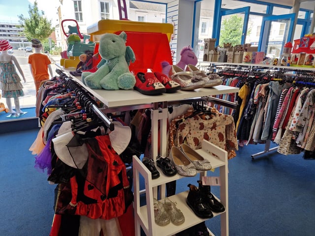 Inside Guild Care's new shop dedicated to children's toys, clothes and equipment, as influencer Jen Graham, known as Charity Shop Girl cuts the ribbon to officially open the Portland Road store