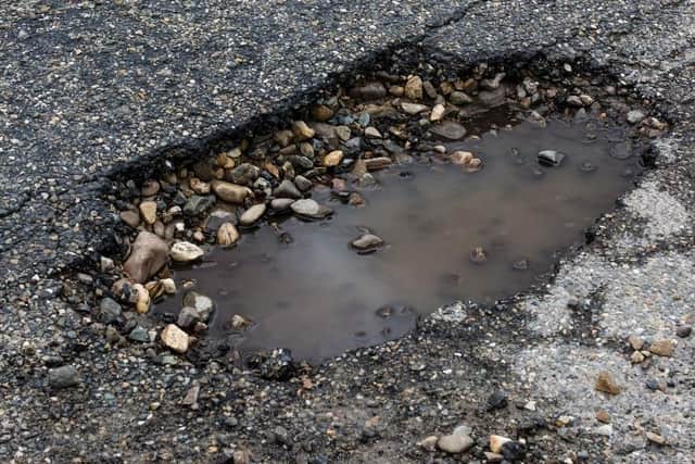 Wealden District Council has passed a motion calling on East Sussex County Council to address problems associating with potholes across the district.