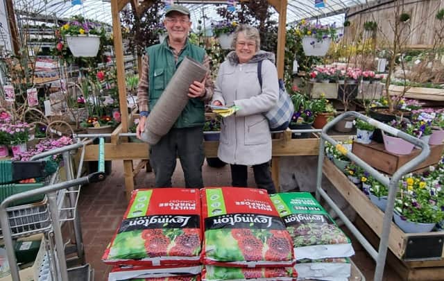 Clive Gravett from The Budding Foundation hands over the donation to Denise Watson who chairs Woodingdean Horticultural Society.