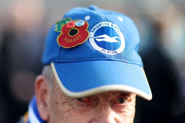 BRIGHTON, ENGLAND - OCTOBER 29: A detailed view of the Brighton & Hove Albion fans hat with a poppy prior to the Premier League match between Brighton & Hove Albion and Chelsea FC at American Express Community Stadium on October 29, 2022 in Brighton, England. (Photo by Alex Pantling/Getty Images)