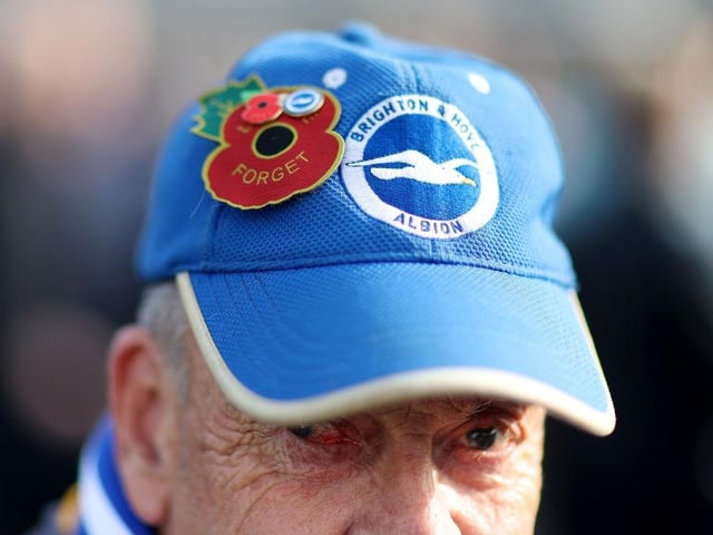 BRIGHTON, ENGLAND - OCTOBER 29: A detailed view of the Brighton & Hove Albion fans hat with a poppy prior to the Premier League match between Brighton & Hove Albion and Chelsea FC at American Express Community Stadium on October 29, 2022 in Brighton, England. (Photo by Alex Pantling/Getty Images)