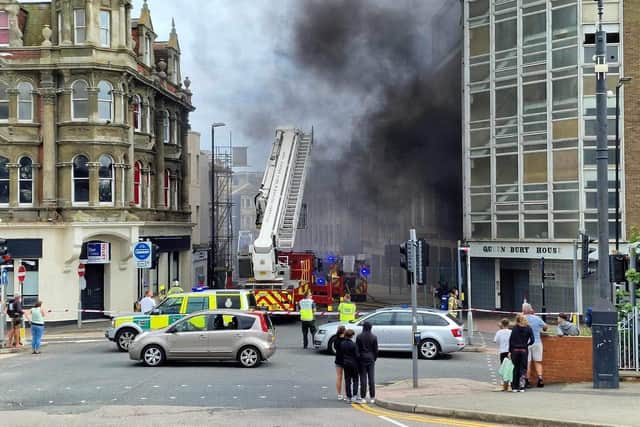 The fire has broken out in a building adjacent to the railway station and multiple fire crews are at the scene. Photo: Simon Offen