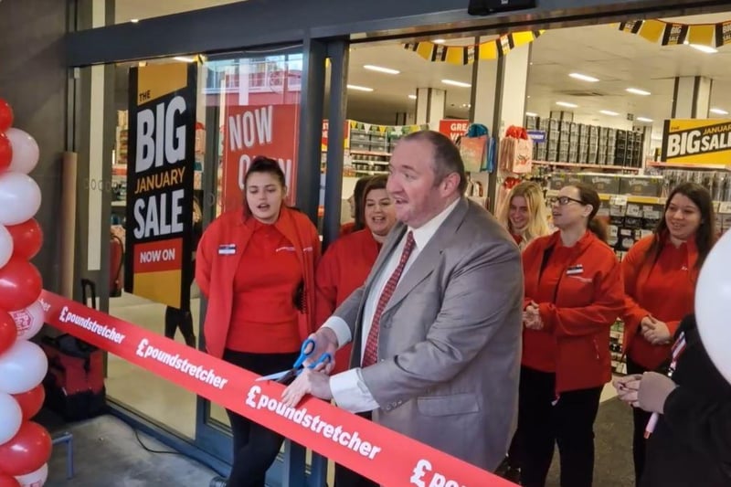 Crawley council leader Michael Jones cuts the ribbon to officially open the new store