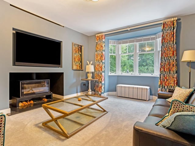 A feature fireplace makes the lounge cosy, without compromising its contemporary character.