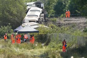 Police, Network Rail and the Rail Accident Investigation Branch at the site of the train derailment on Friday, August 14. Photo: Eddie Mitchell