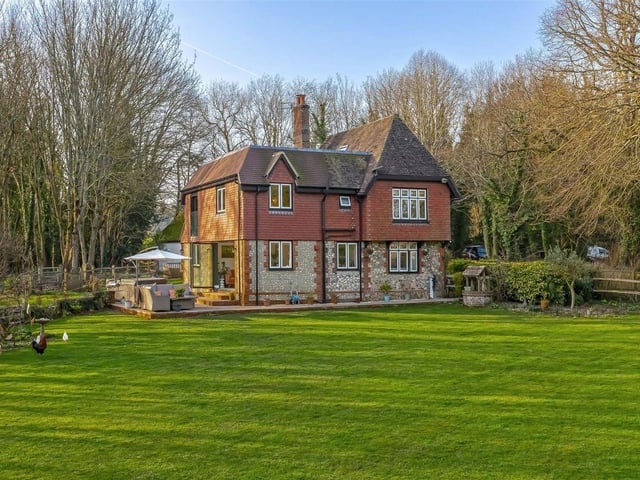 The grounds feature mature planting, expansive lawns and multiple seating areas