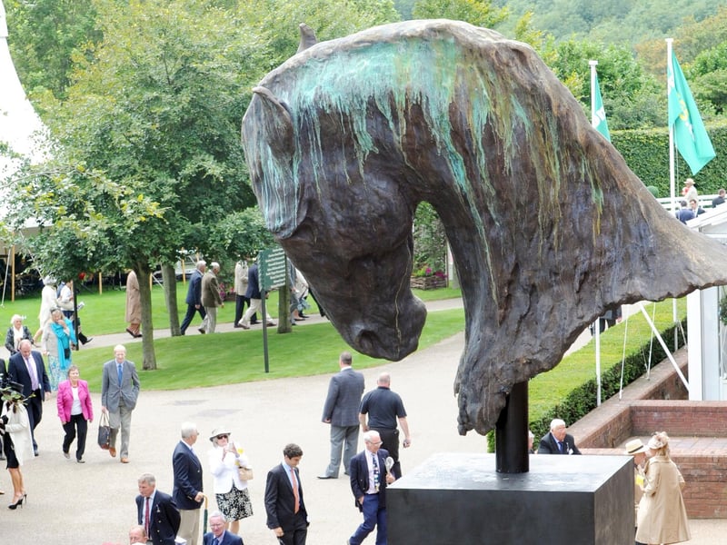 The sculpture is admired by visitors to Goodwood in July 2012