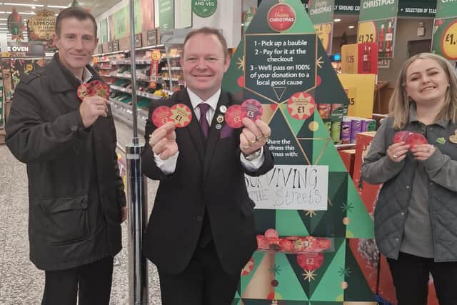 James Robinson, from Surviving the Streets, with Platinum Champion Brett McLean and Rosie Adams, from Morrisons, launching the Christmas campaign