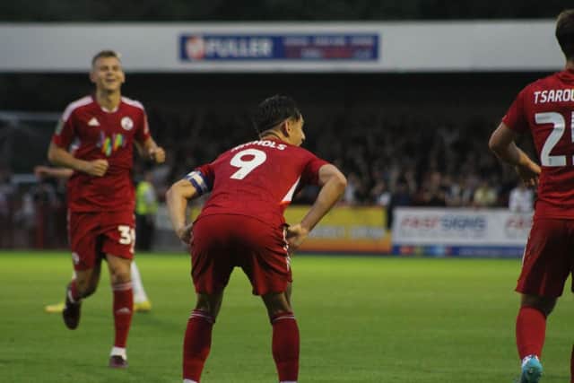 Tom Nichols' cheeky celebration as he gives Crawley Town the lead against Fulham. Picture by Cory Pickford