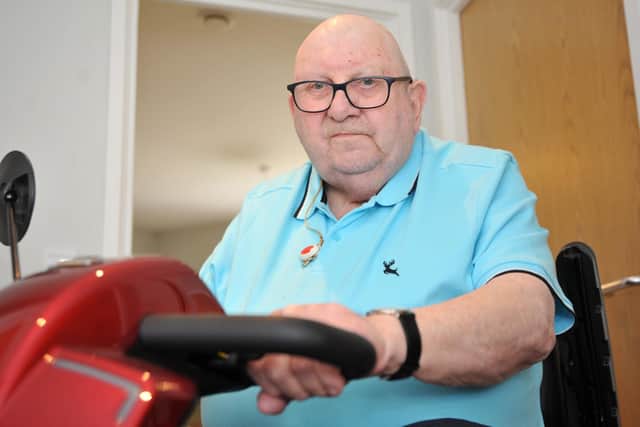Ted Longhurst says he 'risks life and limb' every time he uses his mobility scooter to get to Horsham town centre. He says the pavements are in a shocking state. Pic S Robards SR2305241