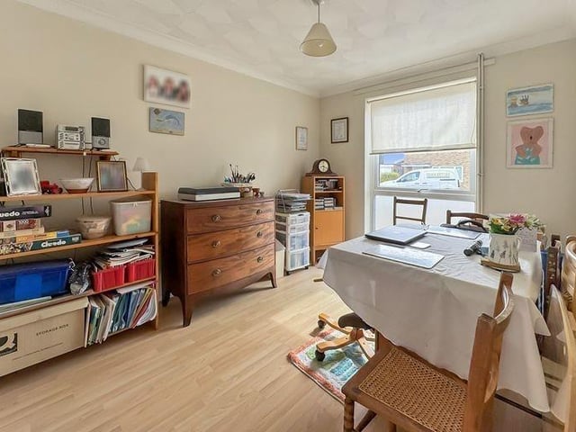 The separate dining room leads to the fitted kitchen