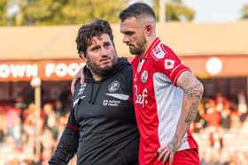 Scott Malone at the end of the Walsall game with head of performance Ricky McFarlane | Picture: Kyle Hemsley