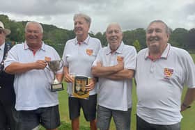 Charles Wright, Steve Judd, Ken Ferguson and Michael Knights are presented with their trophy and pennant.