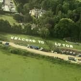 The 'Welcome to Luton' sign near Gatwick Airport was photographed by Abbey Desmond from a plane on Saturday morning, May 21