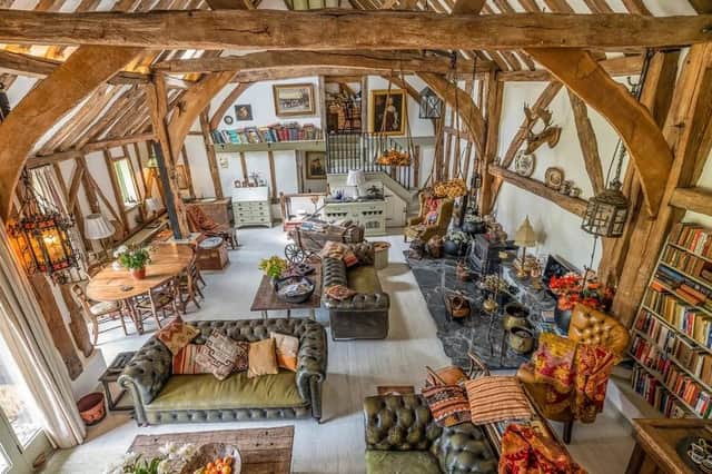 The property has vaulted ceilings and exposed oak beams in a magnificent open plan living room