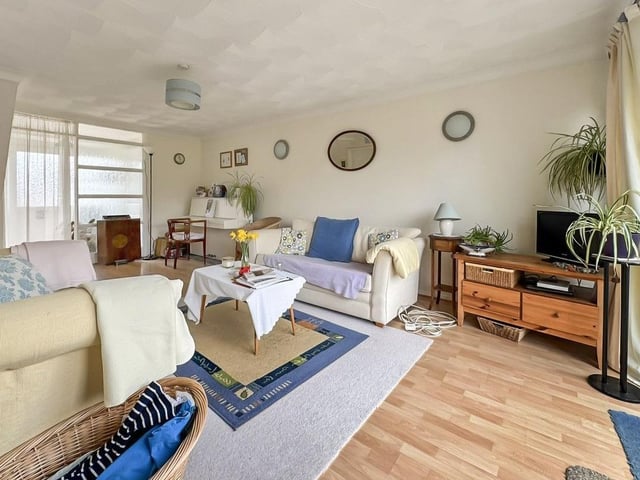 The spacious hallway flows to the large lounge