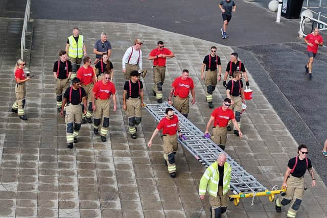 Worthing Firefighters Ladder carry from Worthing Pier to Brighton Pier.