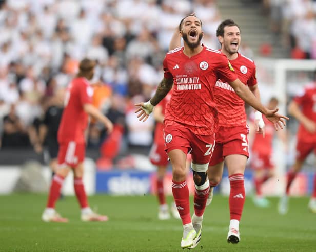 Jay Williams celebrates after scoring his team's first goal against MK Dons. (Photo by Harriet Lander/Getty Images)