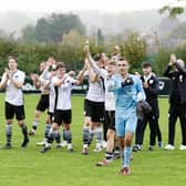 Bexhill United players celebrate their superb win at Hordnean | Picture: Joe Knight