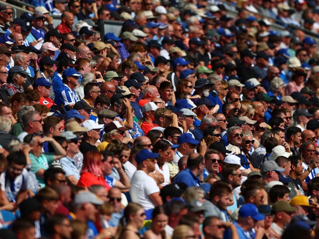 BRIGHTON, ENGLAND - AUGUST 27: Fans watch the Premier League match between Brighton & Hove Albion and Leeds United at American Express Community Stadium on August 27, 2022 in Brighton, England. (Photo by Bryn Lennon/Getty Images)