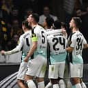 Joao Pedro (C)  celebrates with teammates scoring his team's first goal during the UEFA Europa League Group B football match between AEK Athens FC and Brighton and Hove Albion FC at the Agia Sophia Stadium in Athens (Photo by ANGELOS TZORTZINIS/AFP via Getty Images)