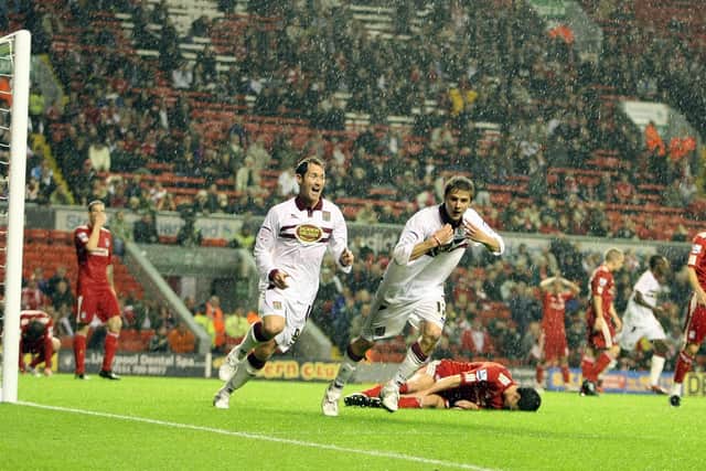 Michael Jacobs (R) of Northampton Town turns to celebrate after scoring his sides second goal during the Carling Cup Third Round match between Liverpool and Northampton Town at Anfield on September 22, 2010.