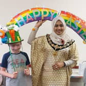 Blake and Ellis Heppenstall, who made their rainbow hat entirely from recycled and charity shop items, with Worthing mayor Henna Chowdhury. Picture: C. L. Greene.