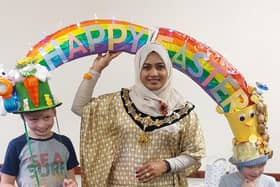 Blake and Ellis Heppenstall, who made their rainbow hat entirely from recycled and charity shop items, with Worthing mayor Henna Chowdhury. Picture: C. L. Greene.