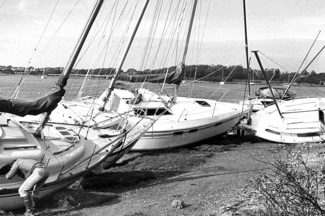 Boats washed up to dry land at Chichester Harbour