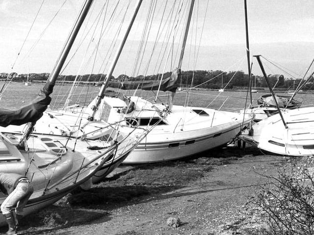 Boats washed up to dry land at Chichester Harbour