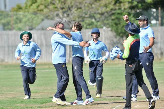 Captain Nick Ballamy celebrates with wicket-taker Harry Dunn | Picture: Stephen Goodger