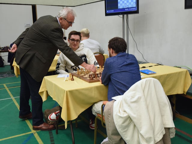 98th Caplin Hastings International Chess Congress on December 28 2024. John Ashworth, Chief Executive Officer Caplin, making the first move.