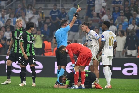 Marseille's Argentine defender #05 Leonardo Balerdi (2nd R) receives a yellow card