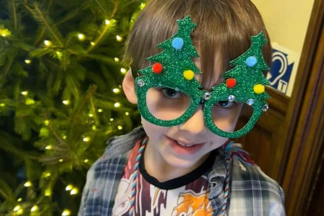 Benji Kennedy-Blee, 7, gets into the Christmas spirit