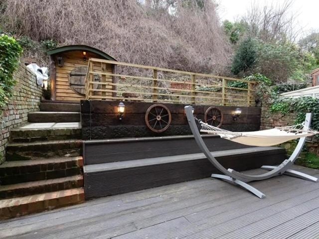 Private rear garden with decking and Hobbit House