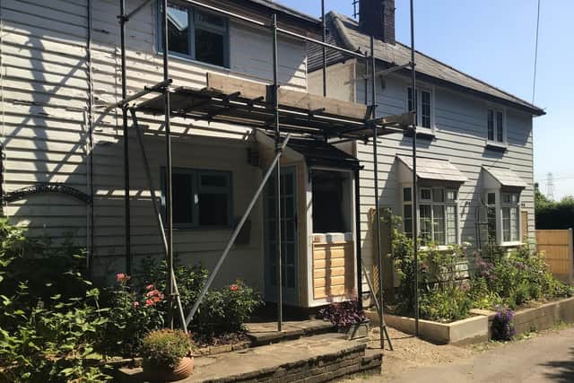 The couple say they tried to blend in their cladding with neighbouring houses