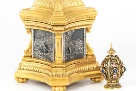 Gold mounted, gem set pomander alongside the Voyage of Life casket