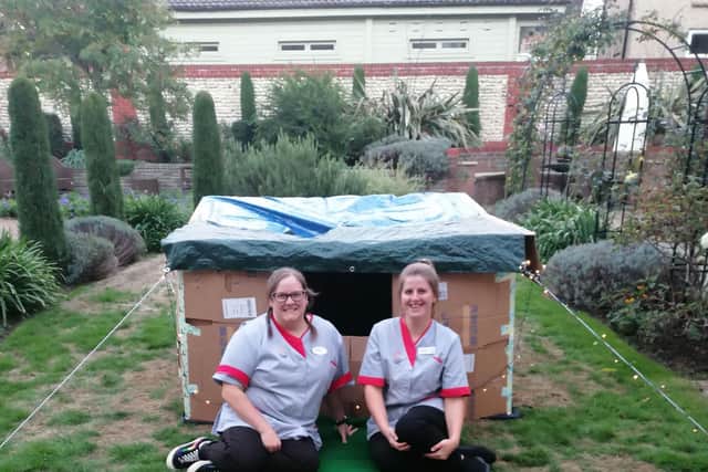 Companionship Team members Heather Pearce, left, and Flo Dudley-Barritt, with the shelter they built at Colten Care’s Wellington Grange care home in Chichester 