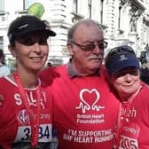 Sally Winn (left) will be running the London Marathon with her sister Sarah (right) to ensure the lifesaving research that helped save their dad (centre) and brother can continue at the British Heart Foundation
