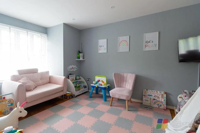 The home has a second reception room, which is being used as a playroom