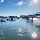 Outrigger canoes line up to to race in Shoreham-by-sea