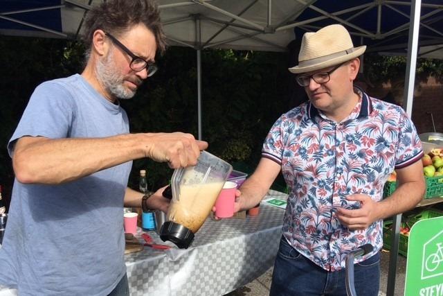 Fruits of their labours, On Yer Bike pouring out a cocktail made by bicycle