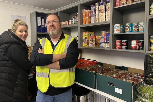 Pulborough Parish Councillor Kevin Lee and his wife Maria setting up the community pantry